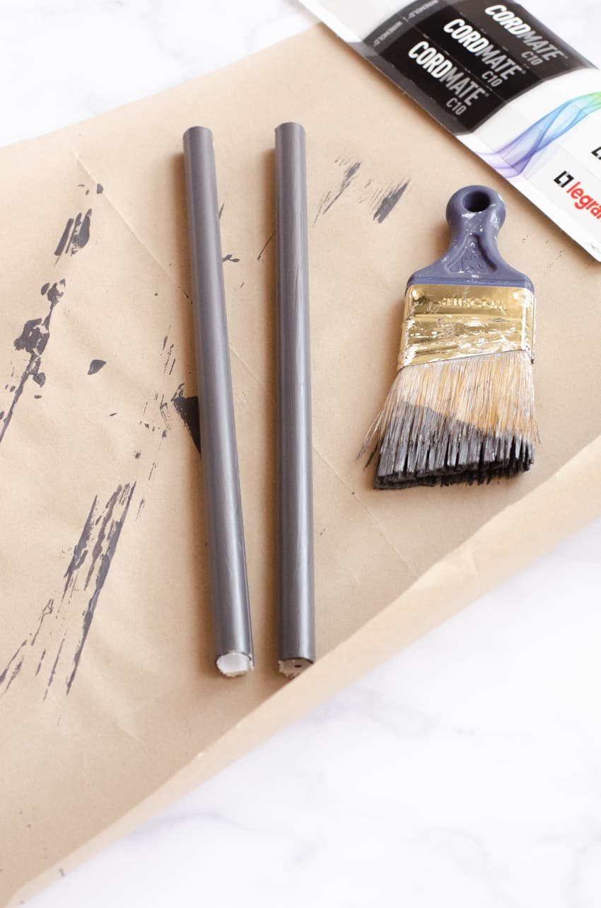 Wall lamp cord covers painted with the matching wall color.