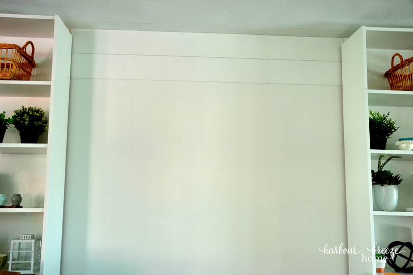 first two boards on the wall for a farmhouse shiplap accent wall
