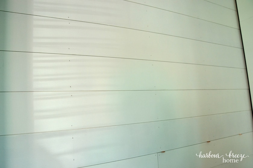 Farmhouse Shiplap Walls accent wall using pennies as spacers