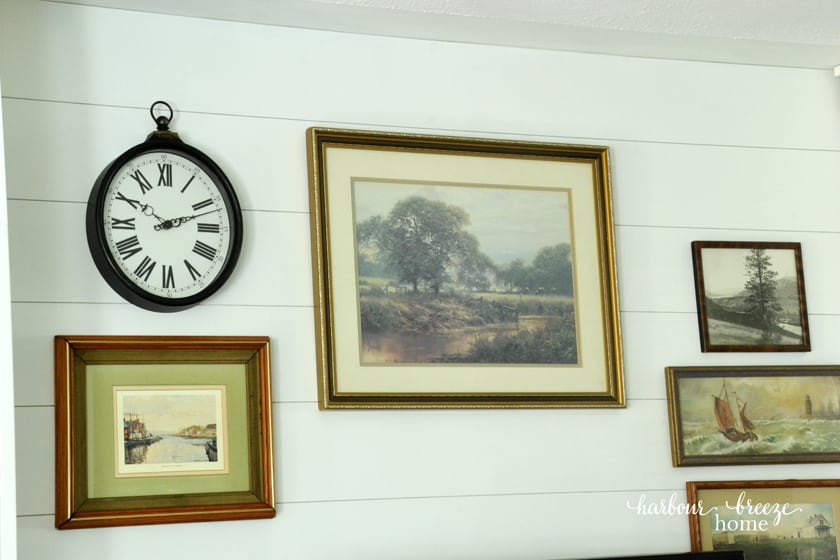 DIY Farmhouse Shiplap Walls with vintage art on them
