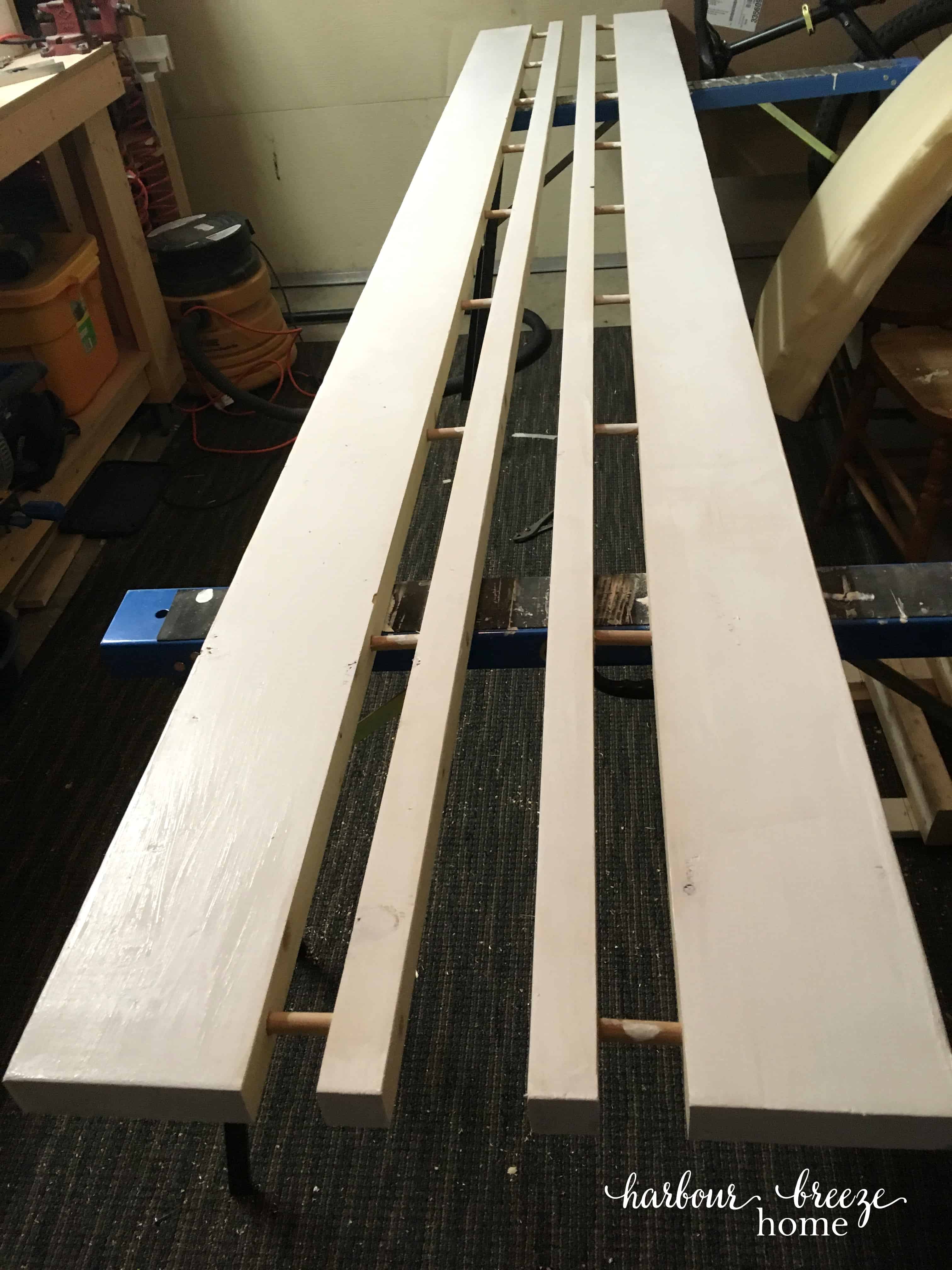 diy floating wall shelves made with a board and dowels