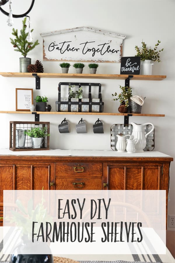 DIY wall shelves with black metal brackets above an antique dining room buffet