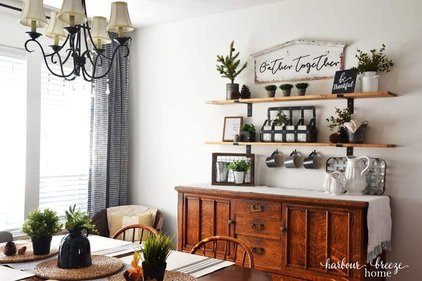 Dining Room table with buffet behind it and farmhouse shelves above it
