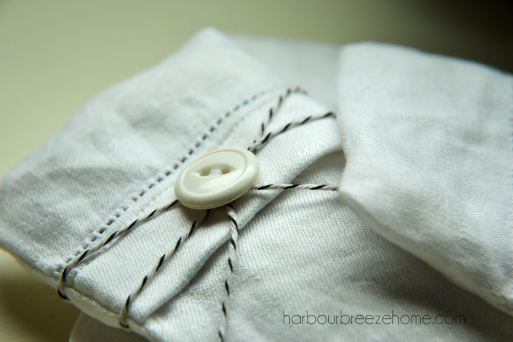 close up of a button on a lavender sachet