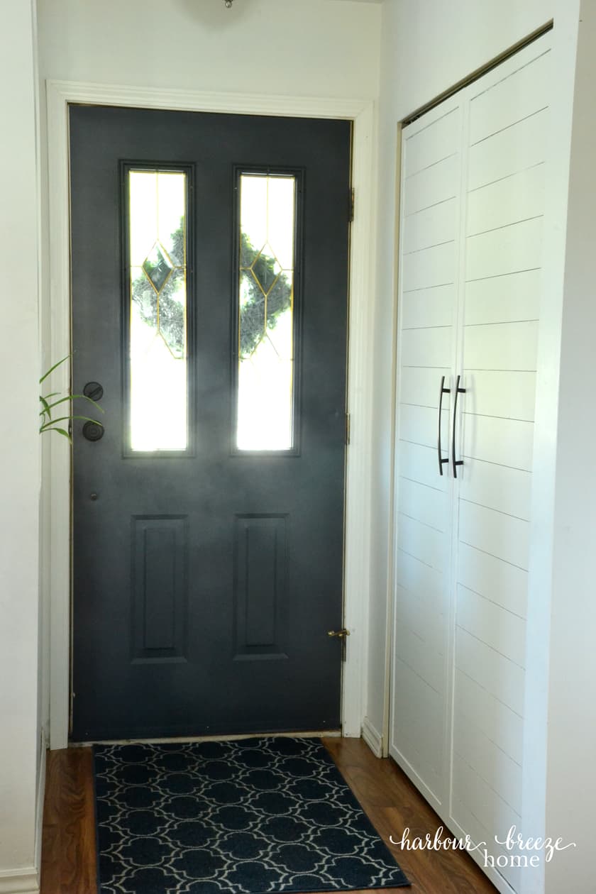 The back of a front door painted the color Raccoon Fur by Benjamin Moore