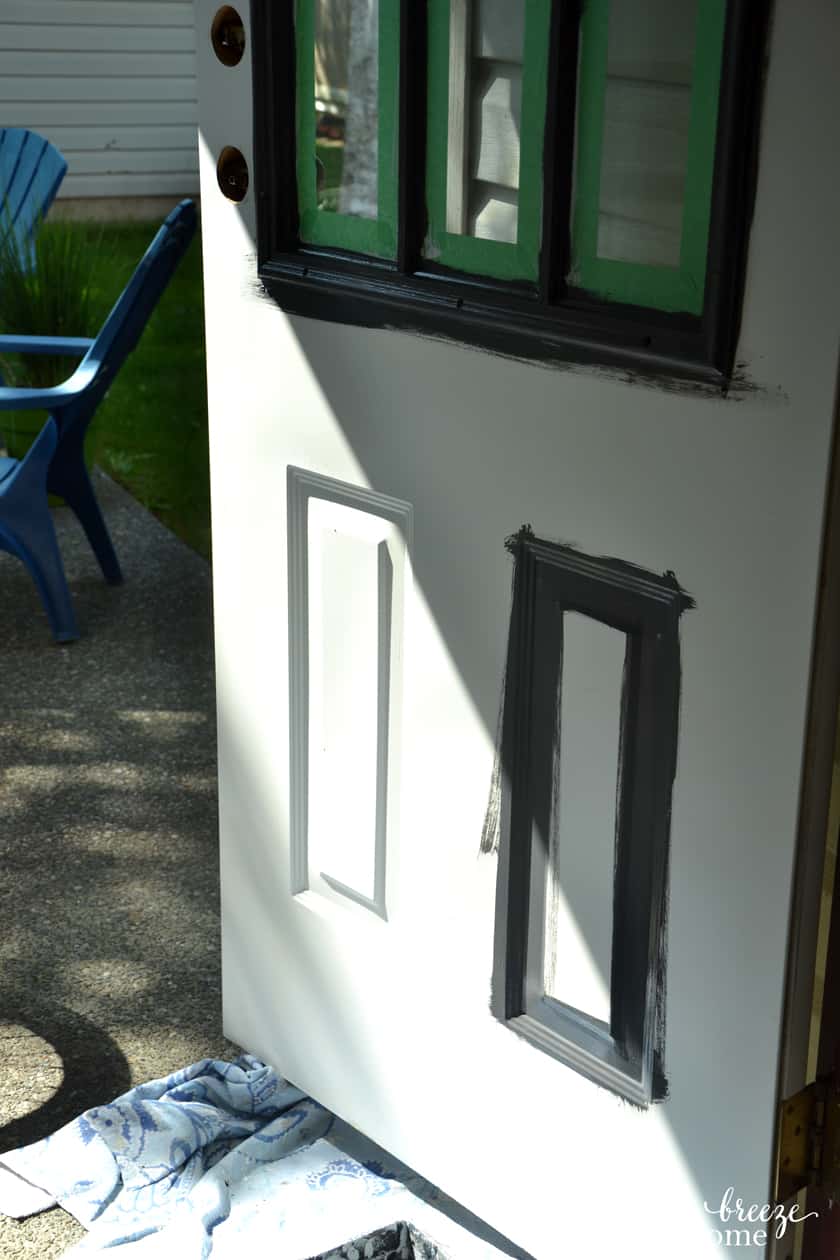 The second step of painting an exterior metal door is to paint any recessed areas in the door.