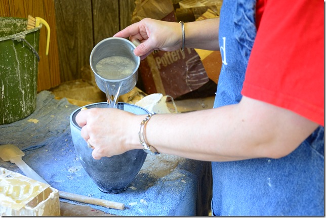 water being added to a rubber plaster mixing bowl