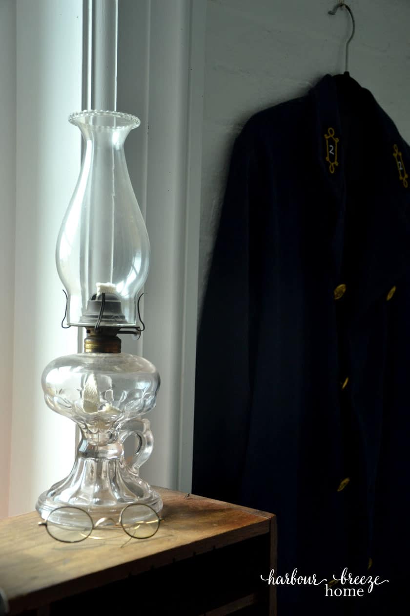 oil lantern by a window