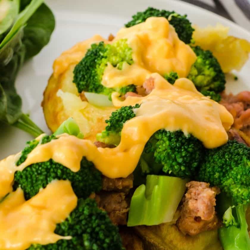 Loaded Baked Potatoes with Sausage and Cheese Sauce