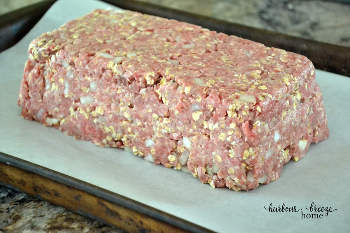 Mealoaf formed on a parchment lined baking sheet