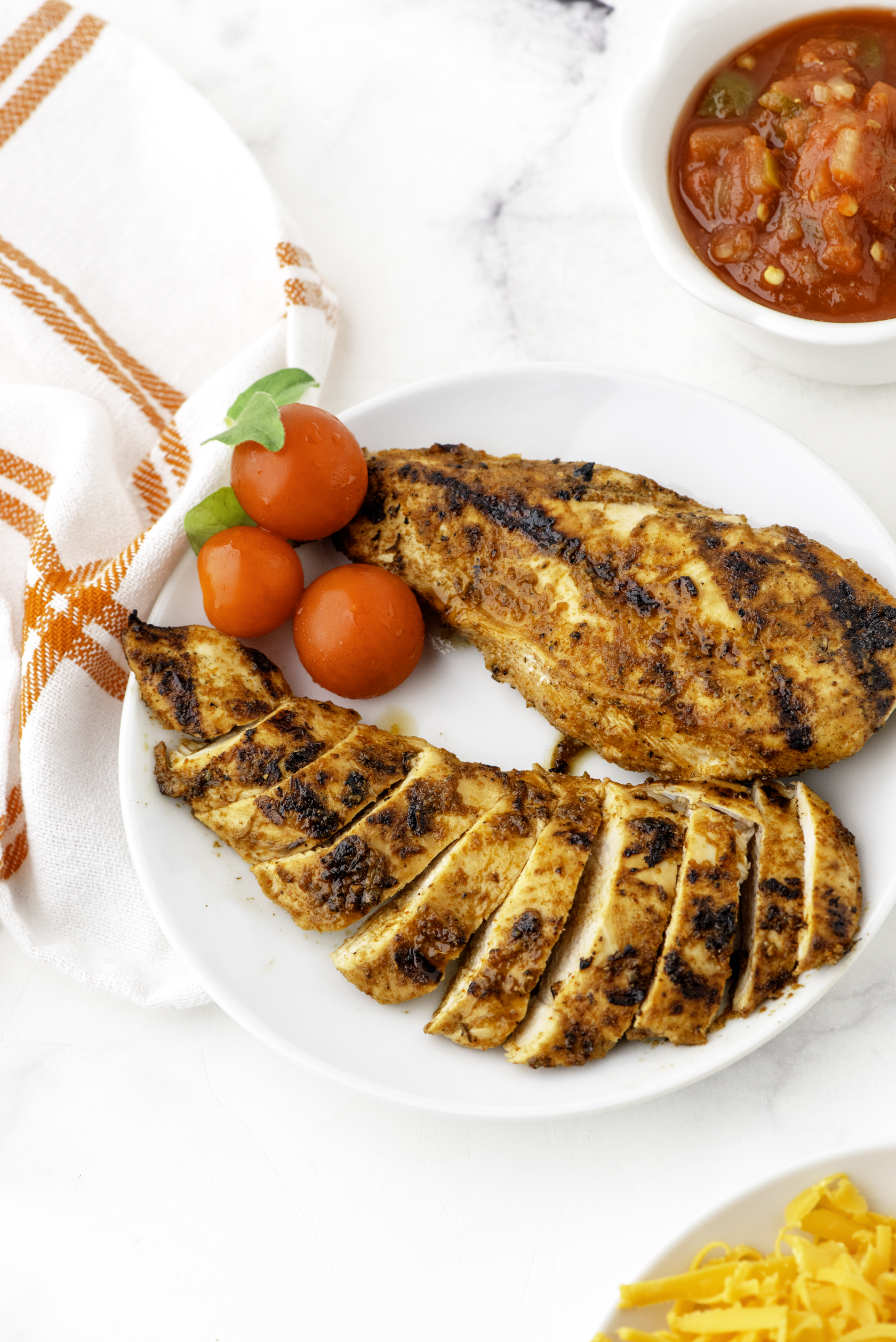A plate of mexican chicken breast marinade after it has been grilled.
