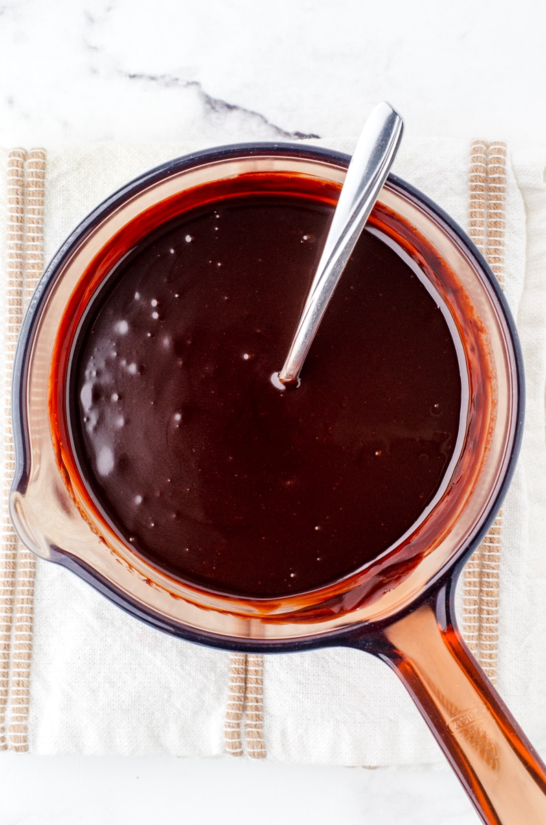 Melted chocolate ganache in a double boiler pan.