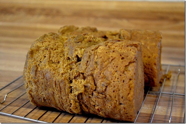 Steamed pudding cooling on a wire rack.