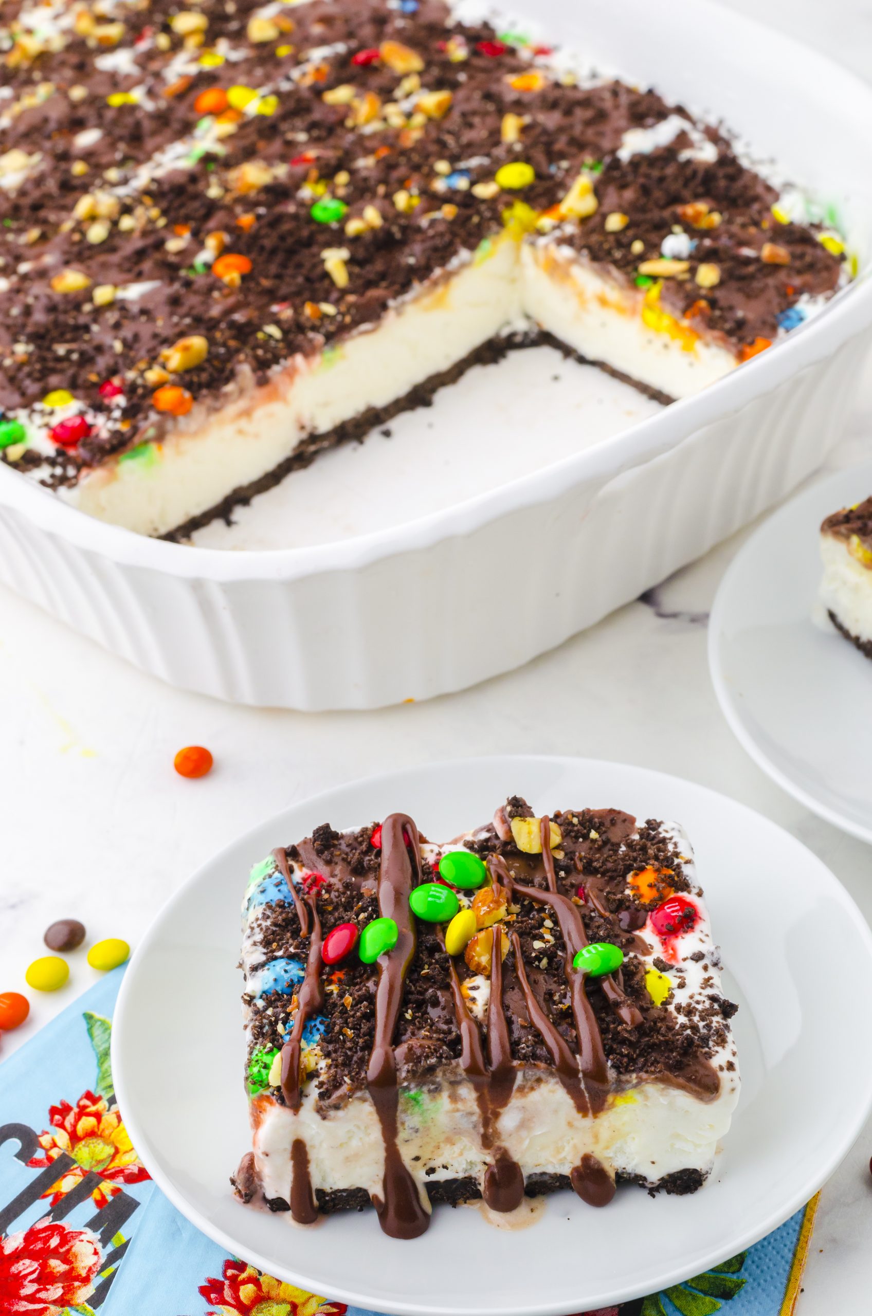 A slice of oreo ice cream cake on a dessert plate
