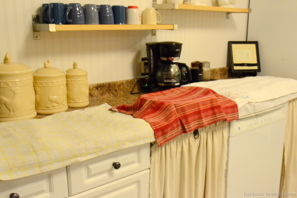 overnight buns lined up on a counter and covered with tea towels