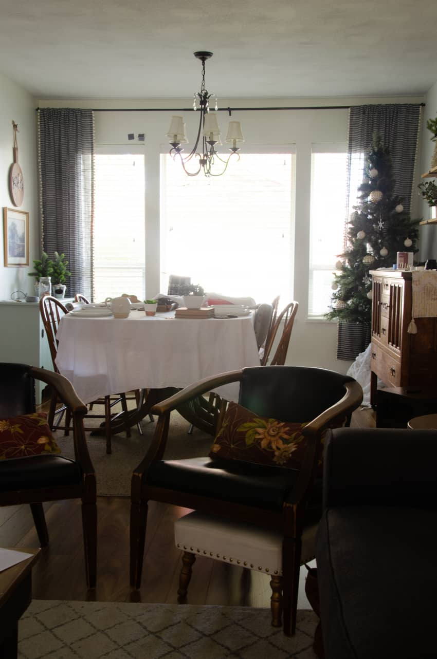a dining room before a dark painted accent wall was added