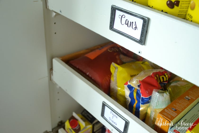 cupboard pantry drawers with grocery items in them