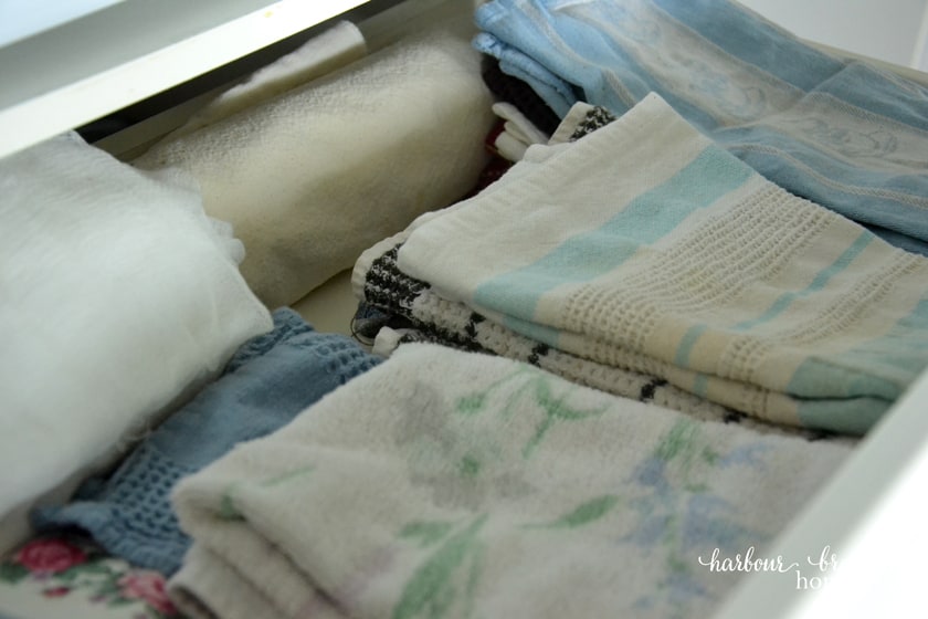 dish towels in an pantry cupboard drawer