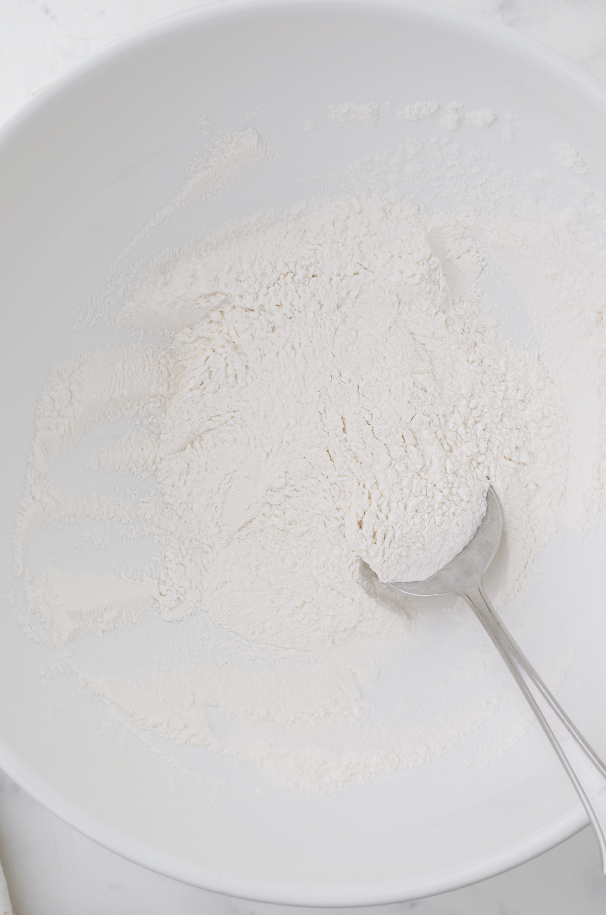 Ingredients for drop dumpling recipe in a large mixing bowl.