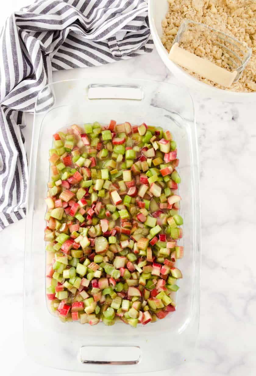 Diced rhubarb in pan after it has been stirred with sugar