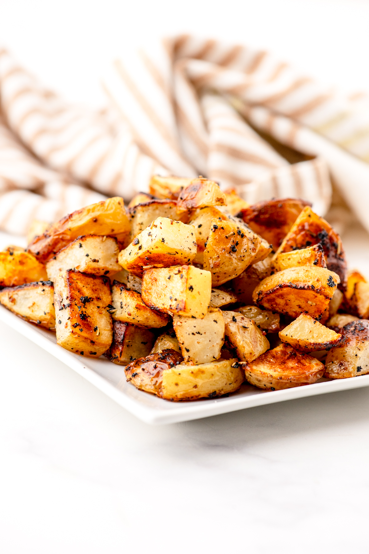 Roasted Diced potatoes on a plate.