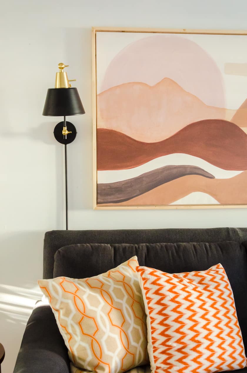 Changing out summer colored throw pillows for the cozy colors of Fall is another quick and easy room decor idea.