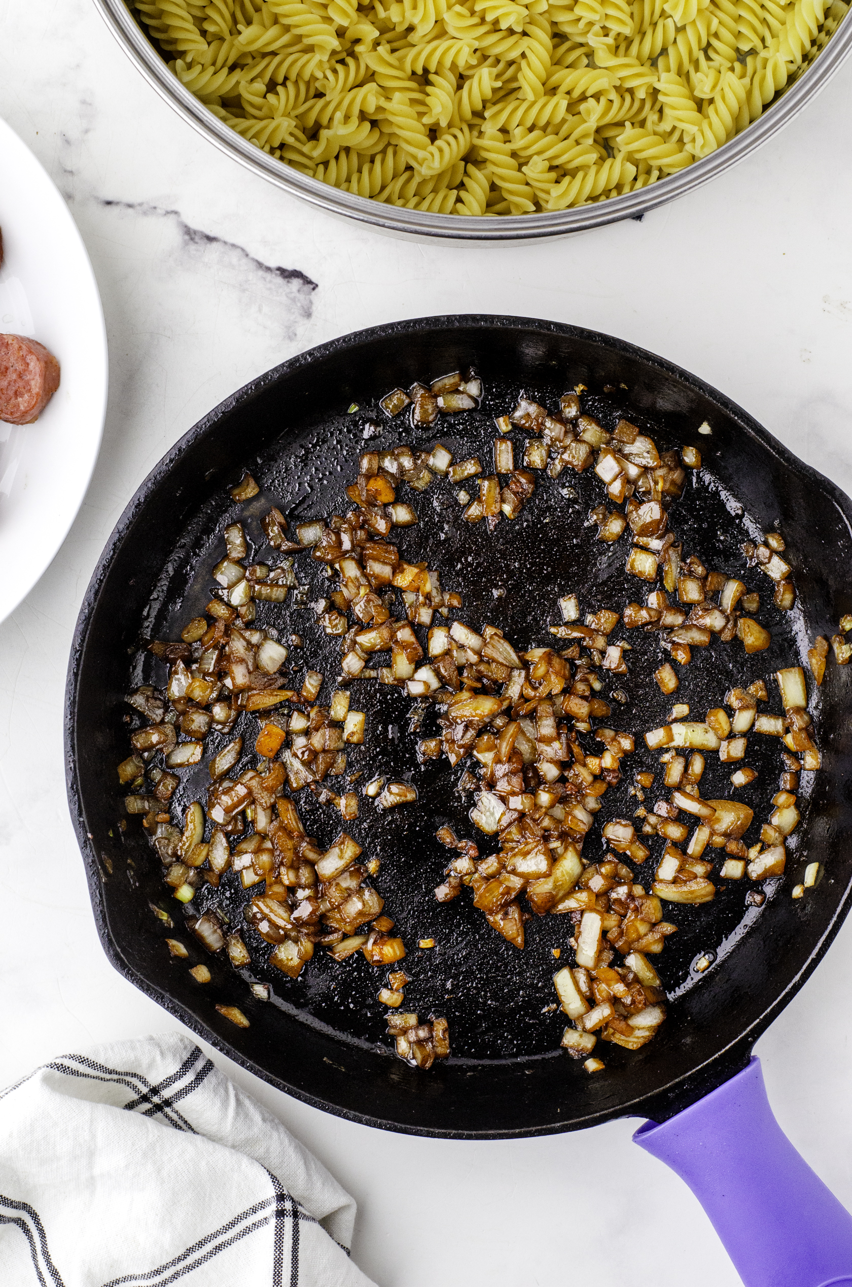 Sauted onions in a cast iron skillet.