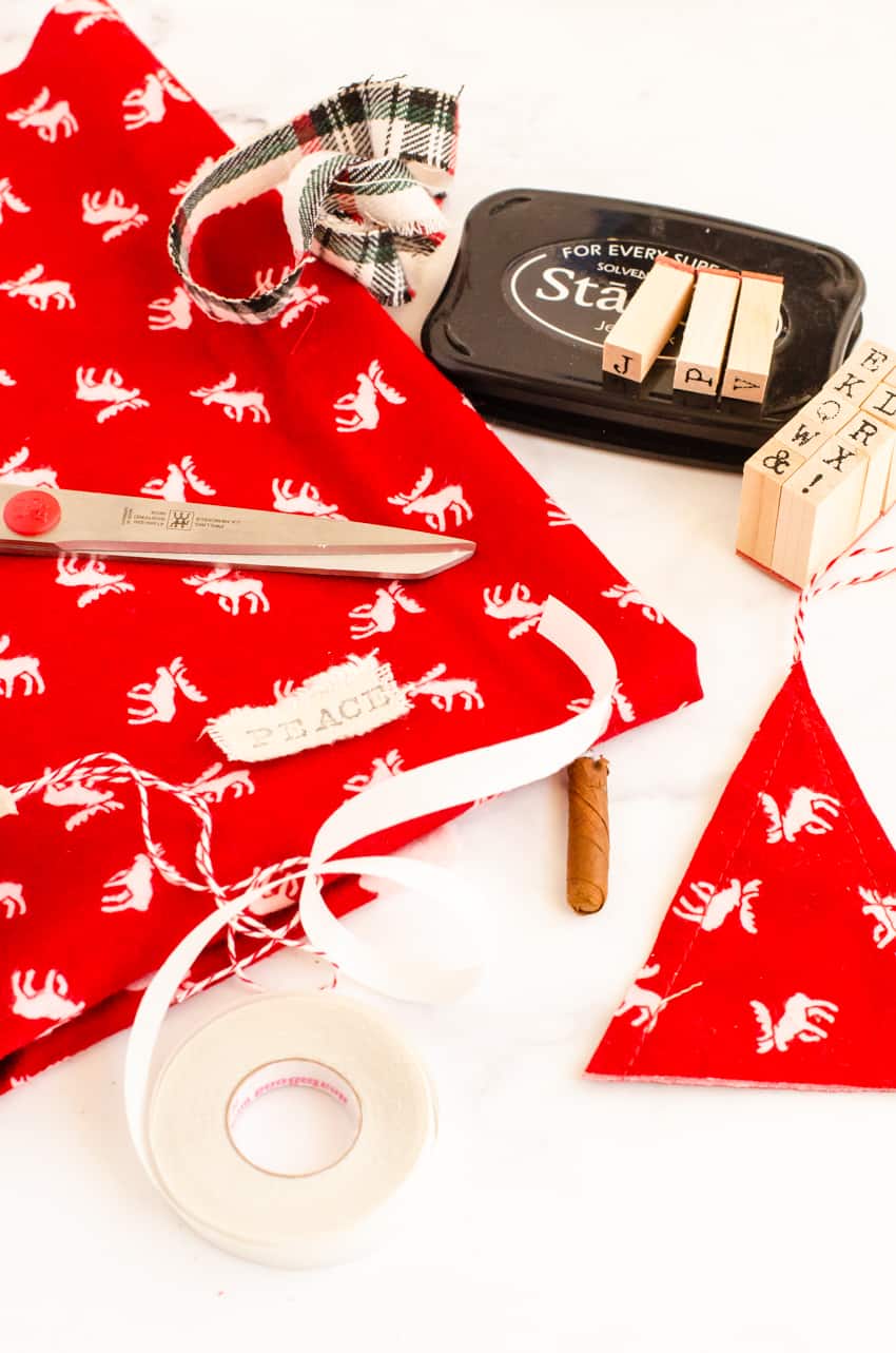Supplies for DIY Scandinavian Christmas Tree Ornaments made with fabric.