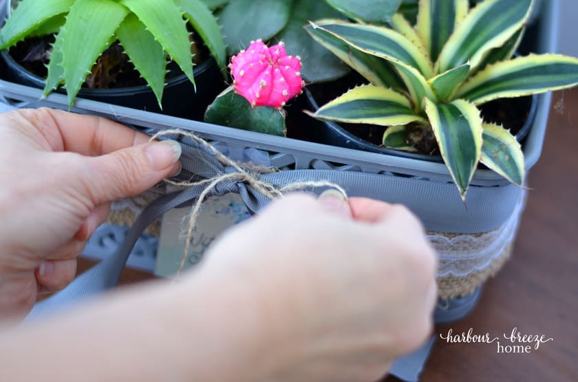 Tie a gift tag ribbon onto the grosgrain ribbon with jute string.