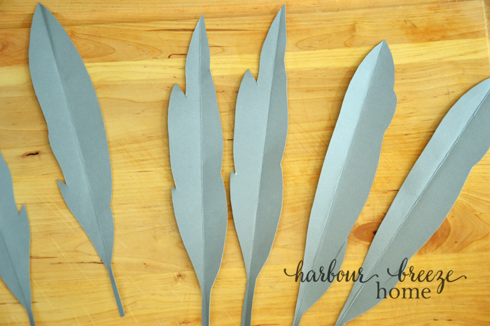 paper feather shapes cut out of cardstock