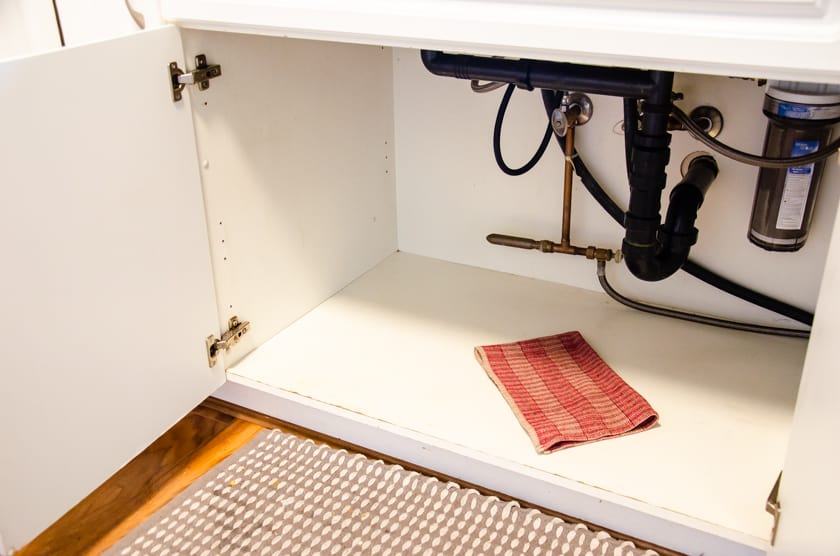 Cupboard under the sink cleaned and dried out.