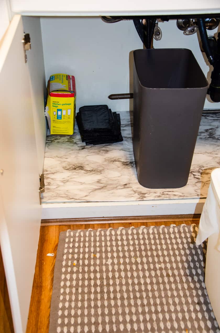 DIY under sink mat placed in cabinet under the kitchen sink
