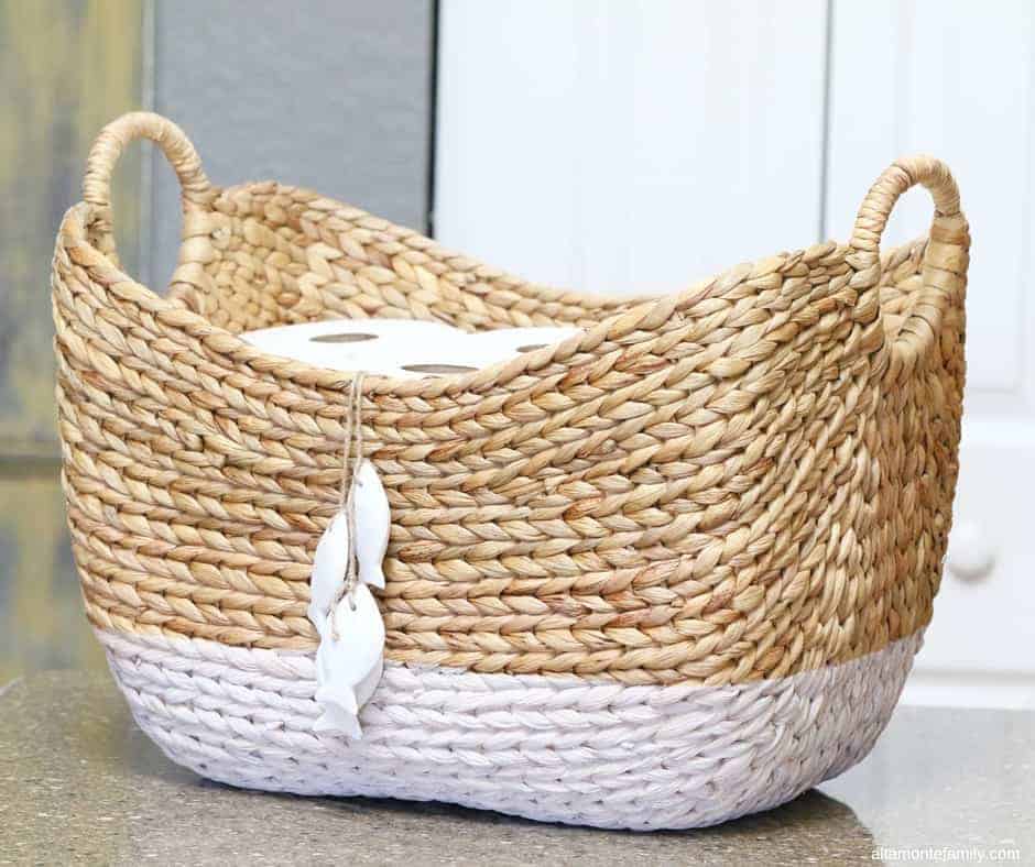 Image for STORE EXTRA TOILET PAPER ROLLS RIGHT OUT IN THE OPEN IN PRETTY BASKETS