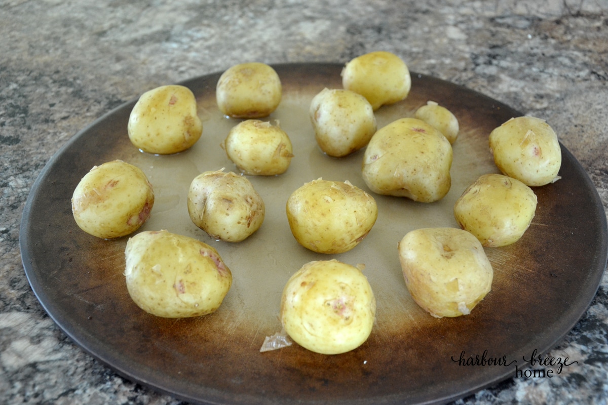 Cooked baby potatoes on a baking pan
