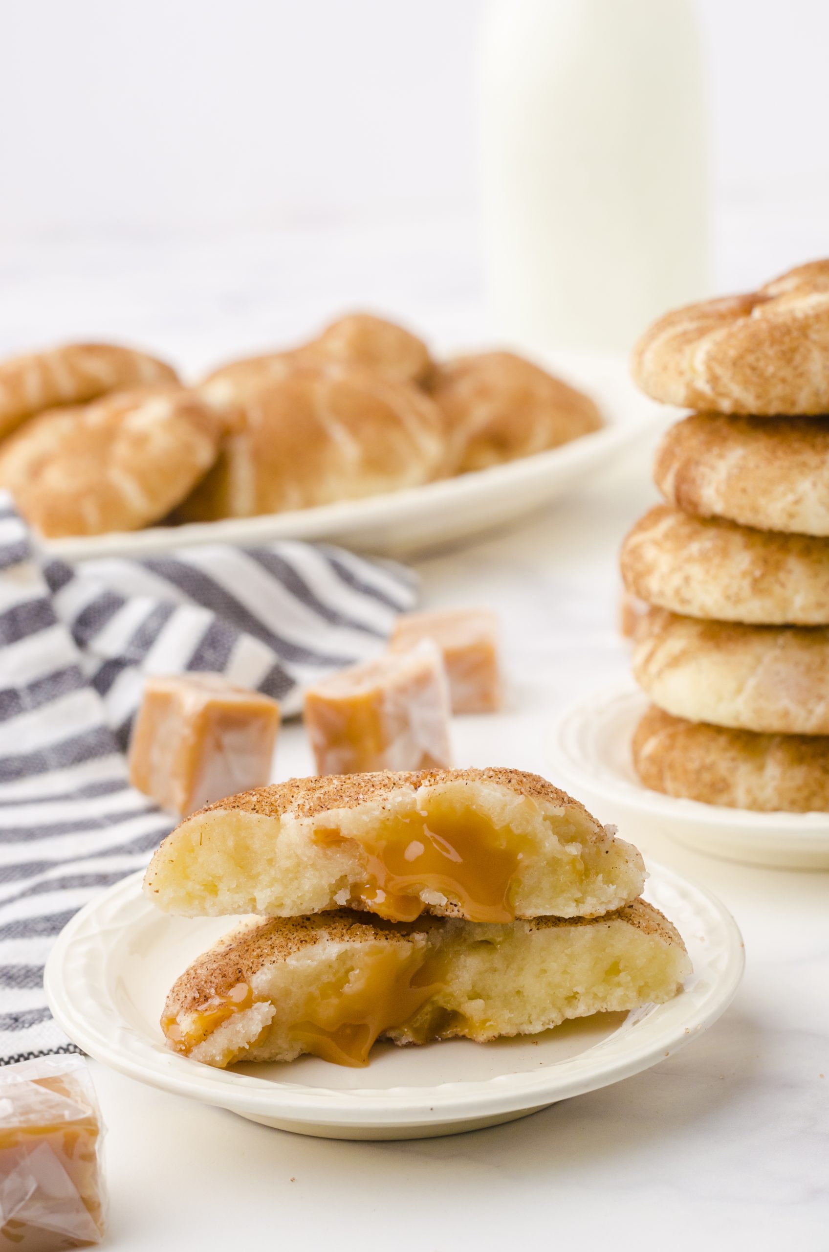 snickerdoodle cookie with caramel sitting on a plate.