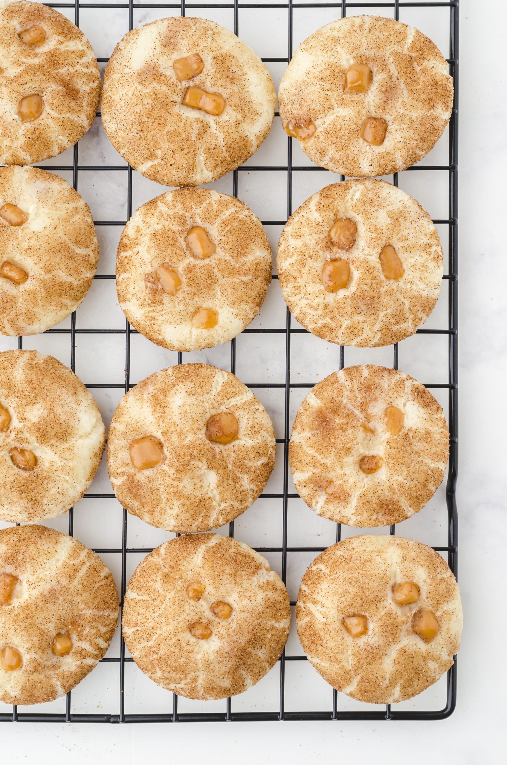 Snickerdoodle caramel bits cookies cooling on a cooling rack