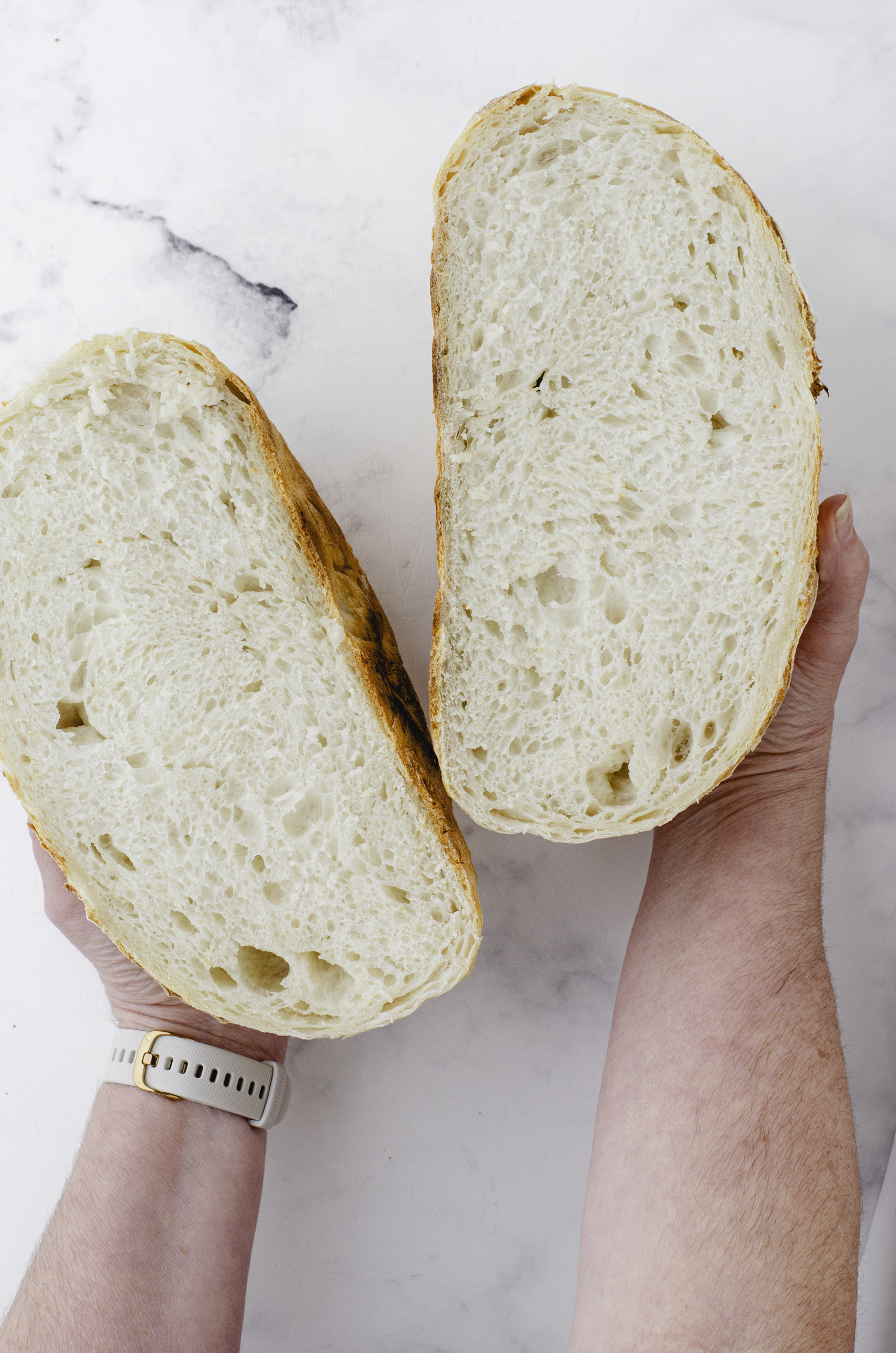 Sourdough bread cut in half to reveal the texture of it.