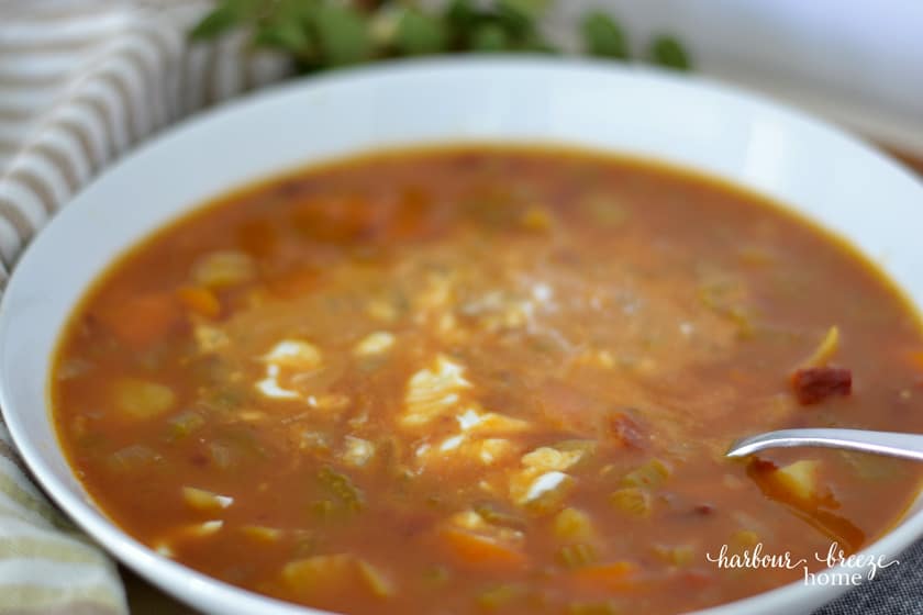 bowl of spicy pumpkin soup with a dollop of greek yogurt on the top