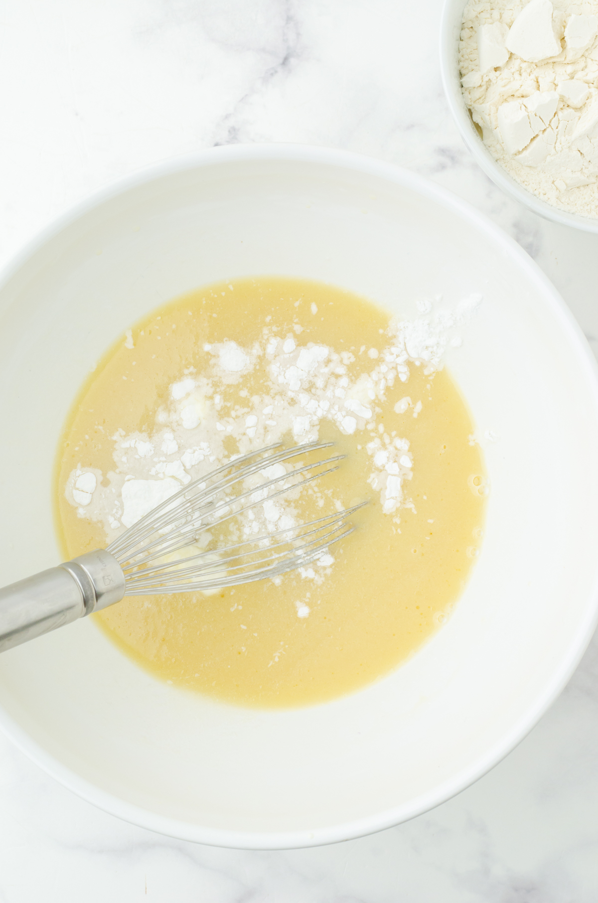 baking powder and salt sprinkled on batter ready to whisk in for strawberry quick bread