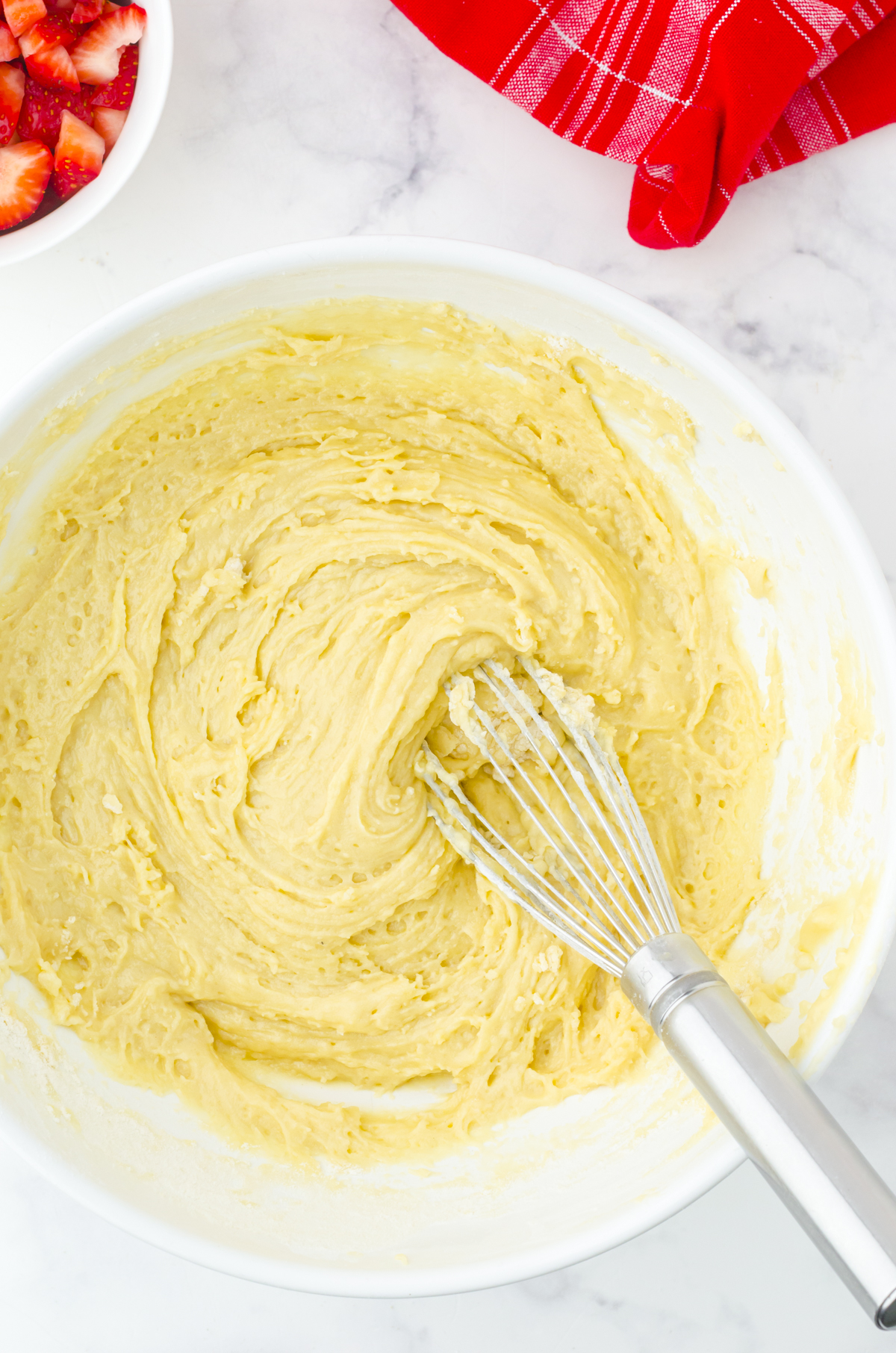 Mixing the flour into the batter.