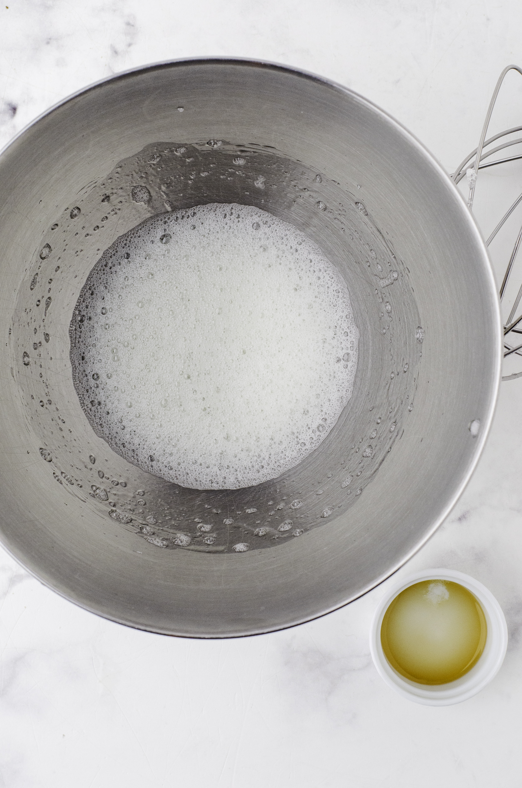 Frothy eggs as the first step to beating eggs for this pavlova recipe.