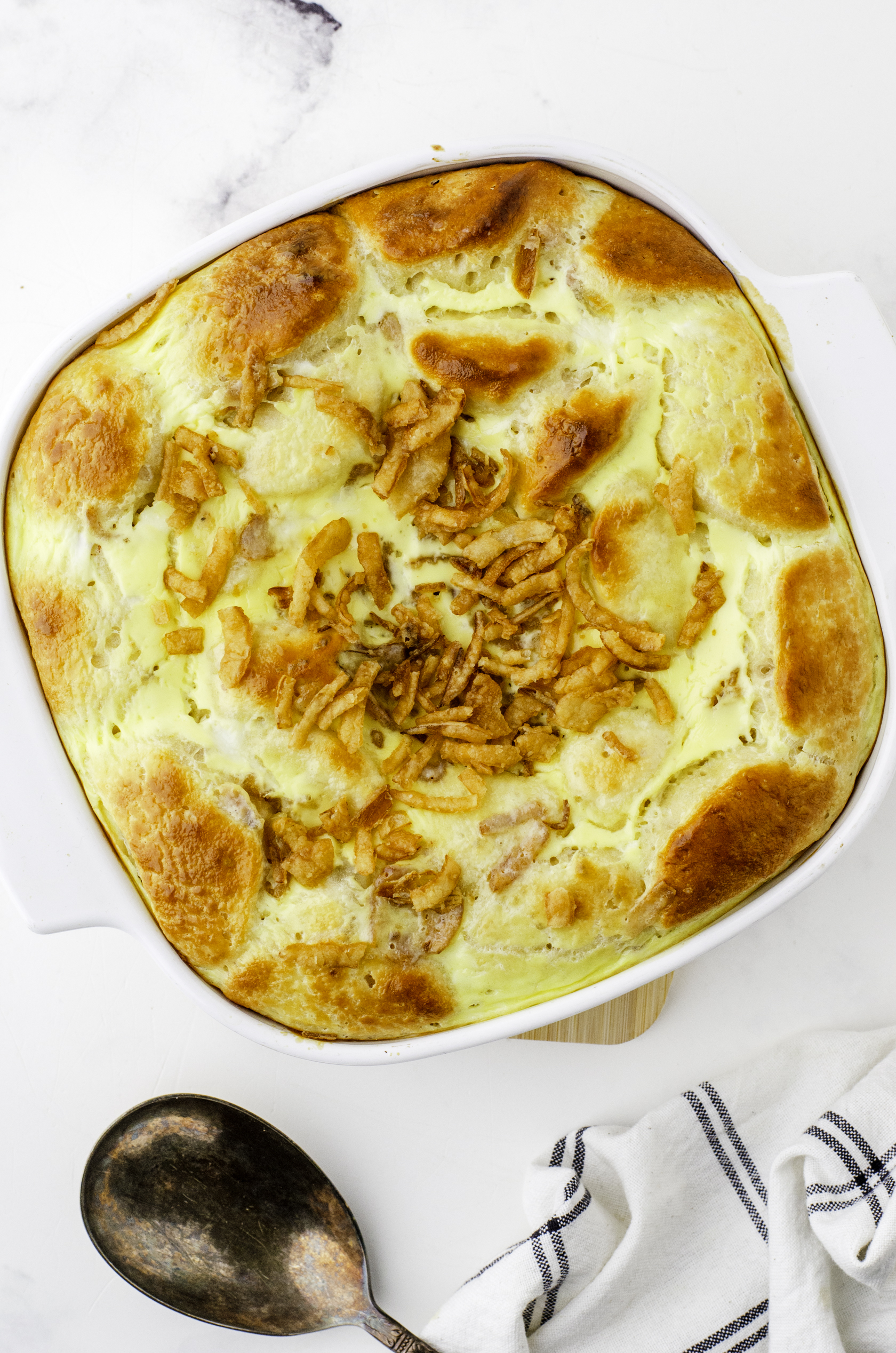 Stoganaff hamburger casserole once it is baked with golden brown biscuits on the top.