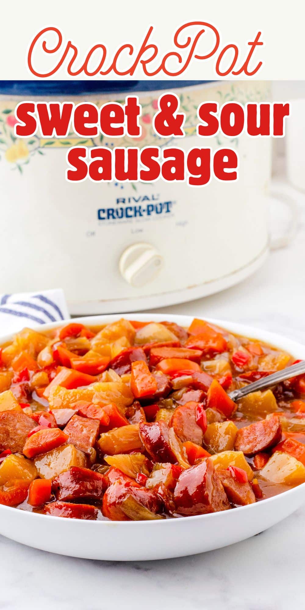 a crock pot with a big bowl of sweet and sour sausage and peppers in front of it.