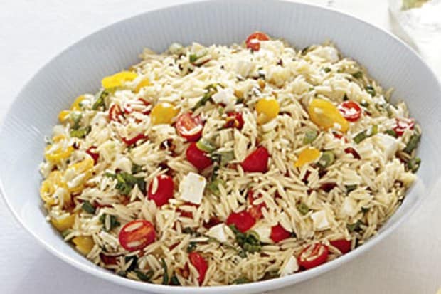 Orzo salad in a white serving bowl