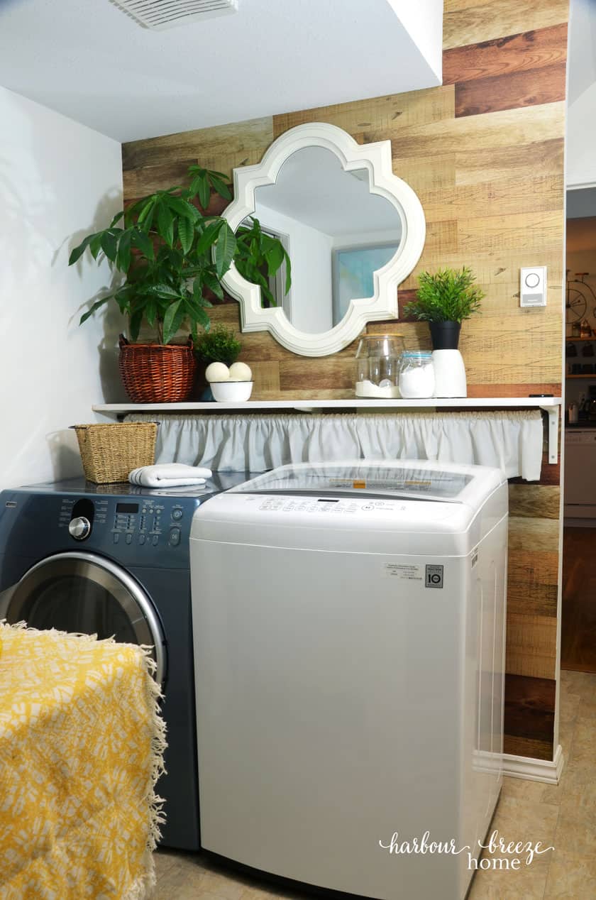 Farmhouse style Laundry Room with wood wall accent