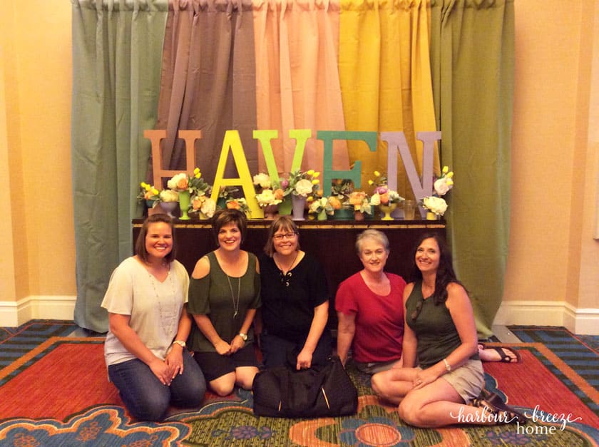 Haven sign with women in front of it