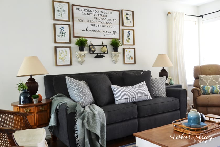 Dark Gray Edie La-Z-Boy Sofa in townhouse living room with lamps to the sides and pictures above it