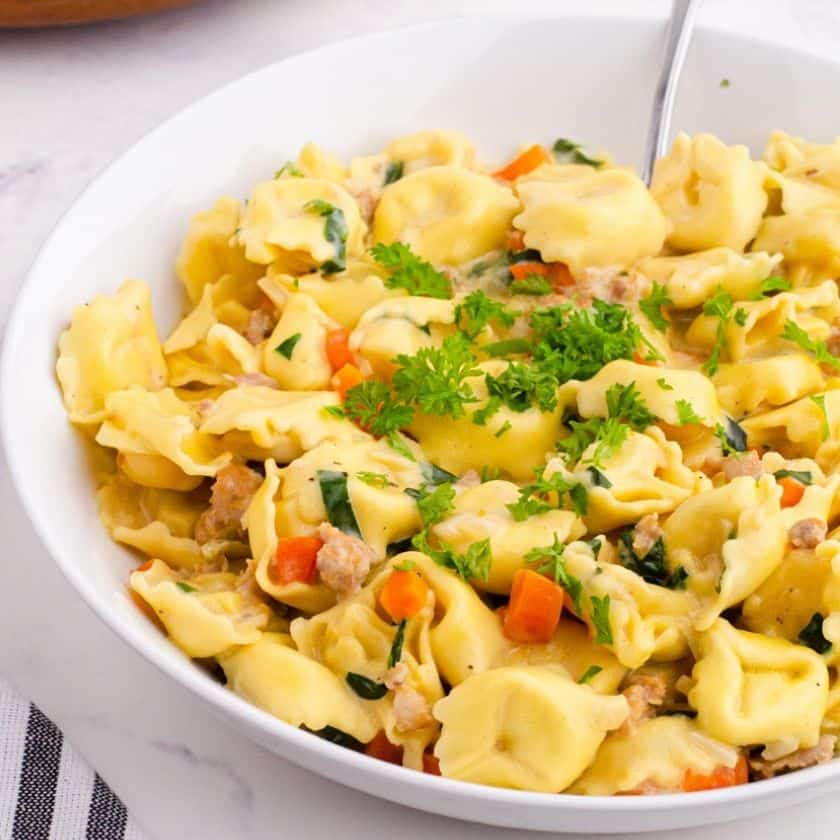 Rich Tortellini Soup with Sausage and Fresh Greens