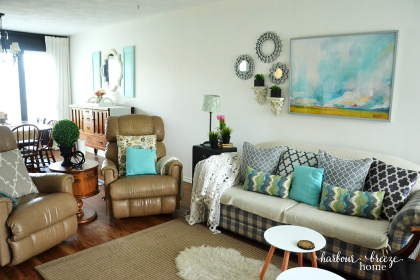 couch and 2 chairs in a townhouse living room