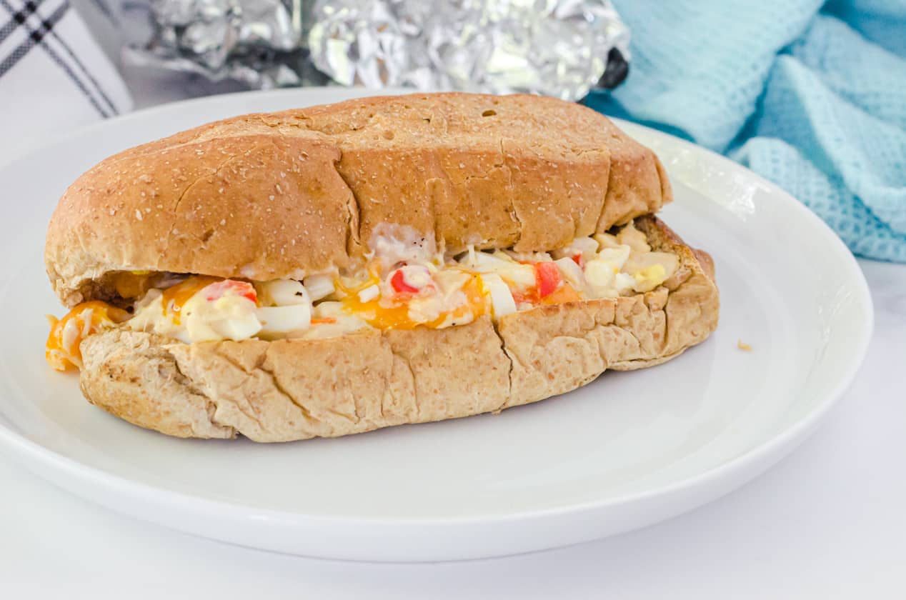 a hot bumstead sandwich on a lunch plate ready to eat.
